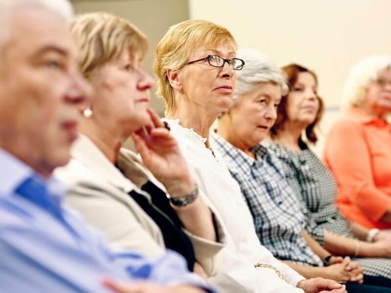 Seniors listening to a discussion topic