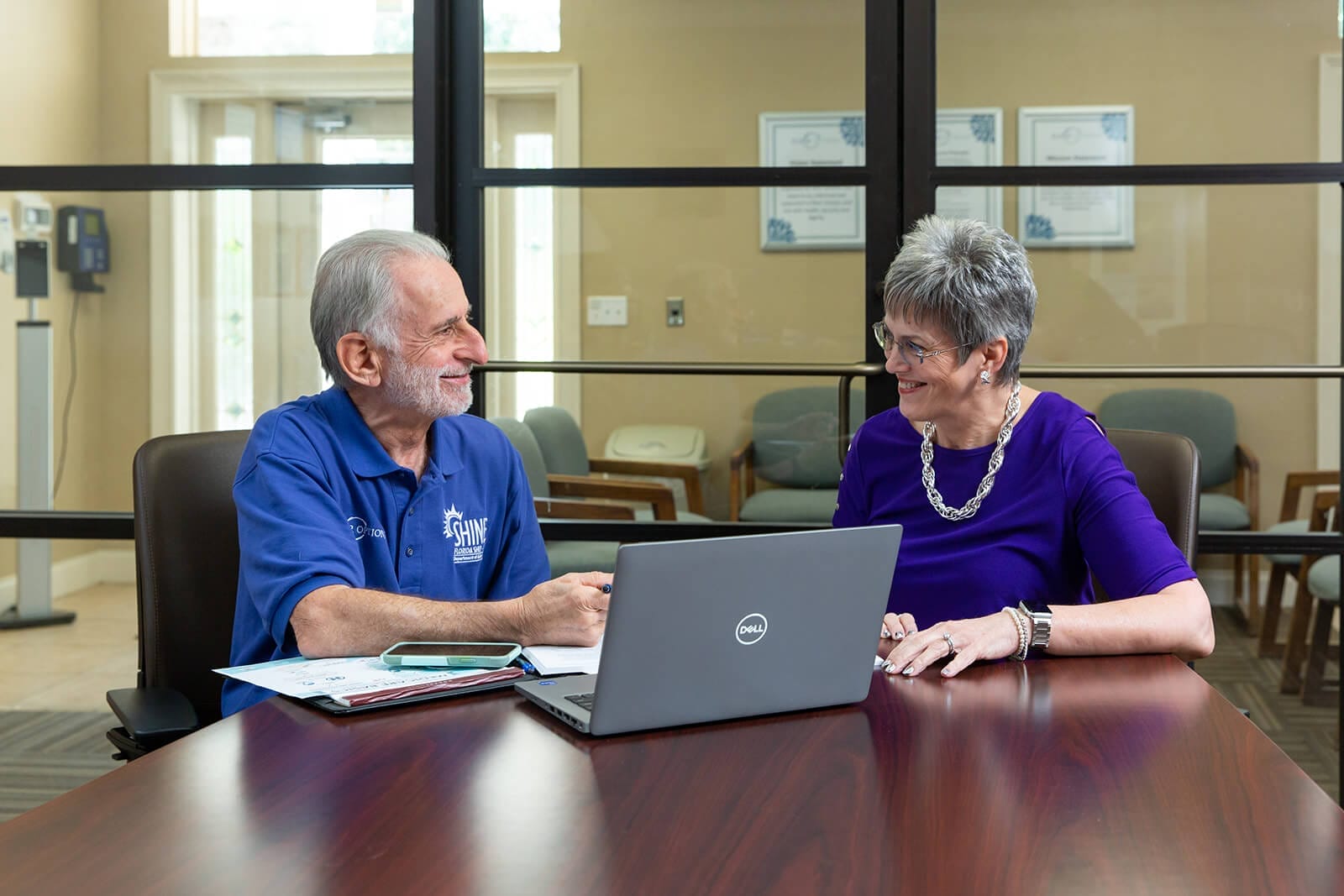 SHINE Volunteer assists client with computer and Medicare